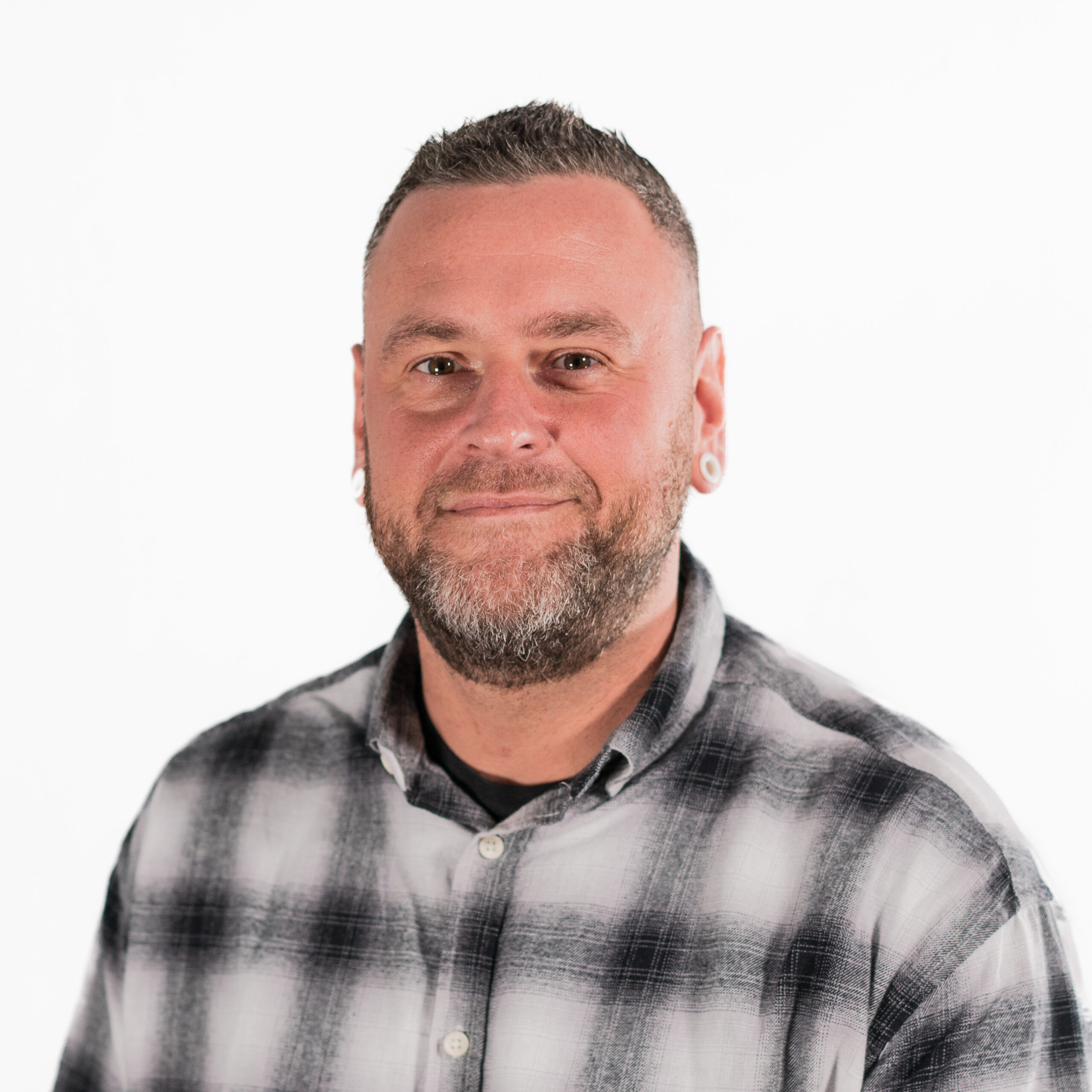 A headshot of Arwyn, an employee at Creditsafe.