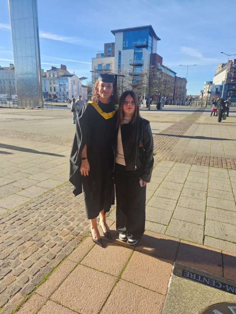 Kelly celebrating her graduation from her degree apprenticeship.